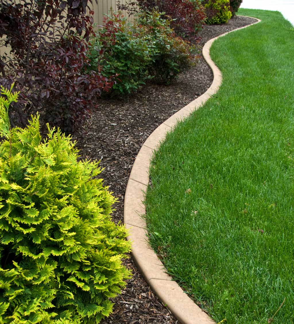 A lawn with a curving masonry edge